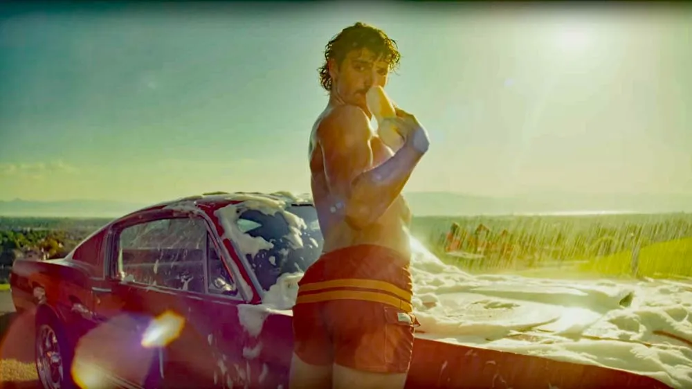 Watch: Benson Boone Sheds His Shirt and Soaps Up for 'Mr Electric Blue'